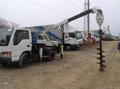 Ямобур Isuzu ELF ( услуги по бурению БКМ)