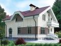 Двухэтажный кирпичный дом в стиле модерн с фигурной крышей.